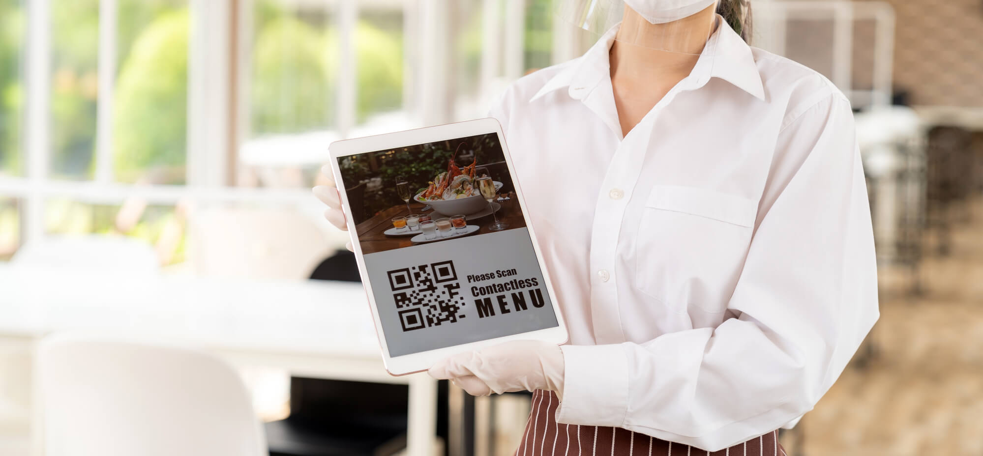 Restaurant post-covid Strategies example, waiter displaying a contactless menu