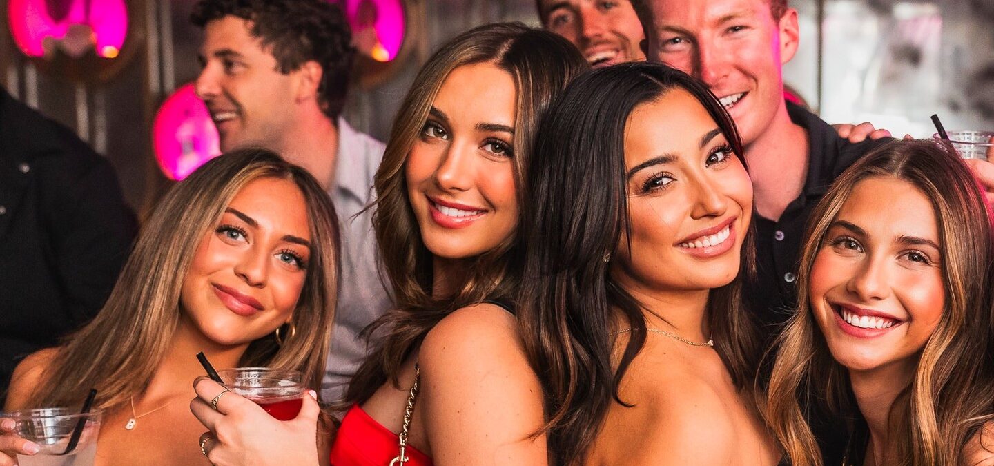 Group of friends with drinks at CAKE Nightclub