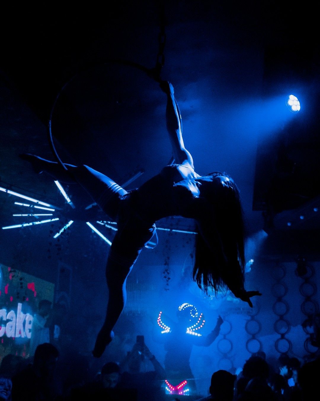 Aerial performer above the dance floor at CAKE Nightclub