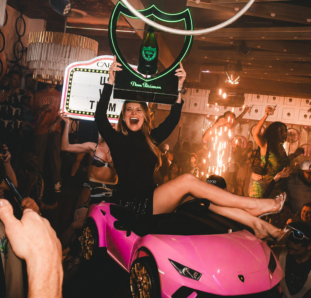 Bottle presentation with sparklers and a pink toy car at CAKE Nightclub