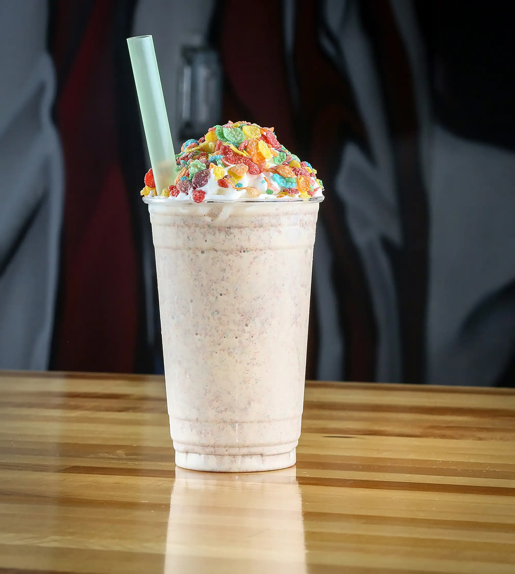 Fruity Pebbles milkshake topped with whipped cream and cereal at BRGR STOP