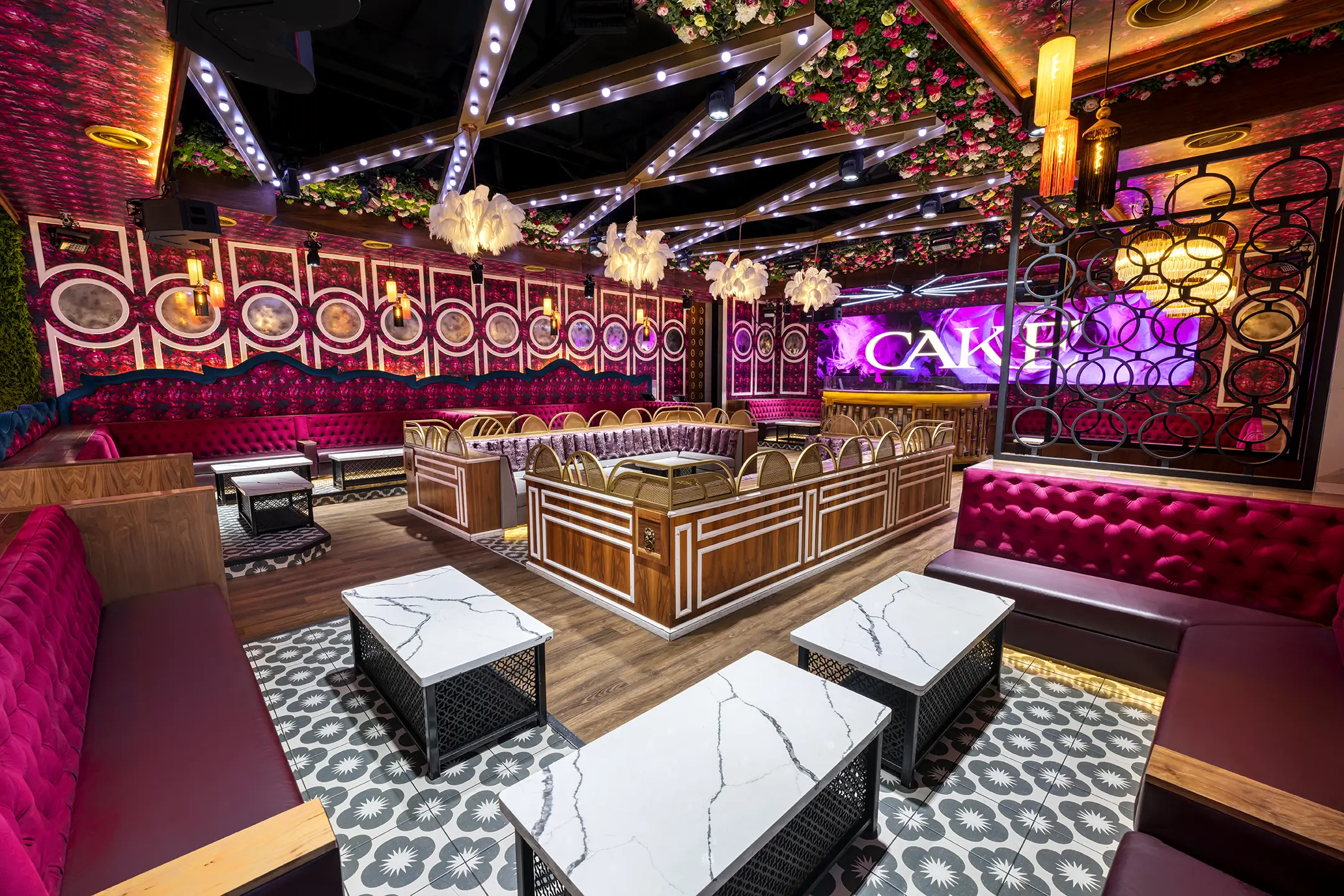 Lounge booths and marble tables at CAKE Nightclub in Scottsdale