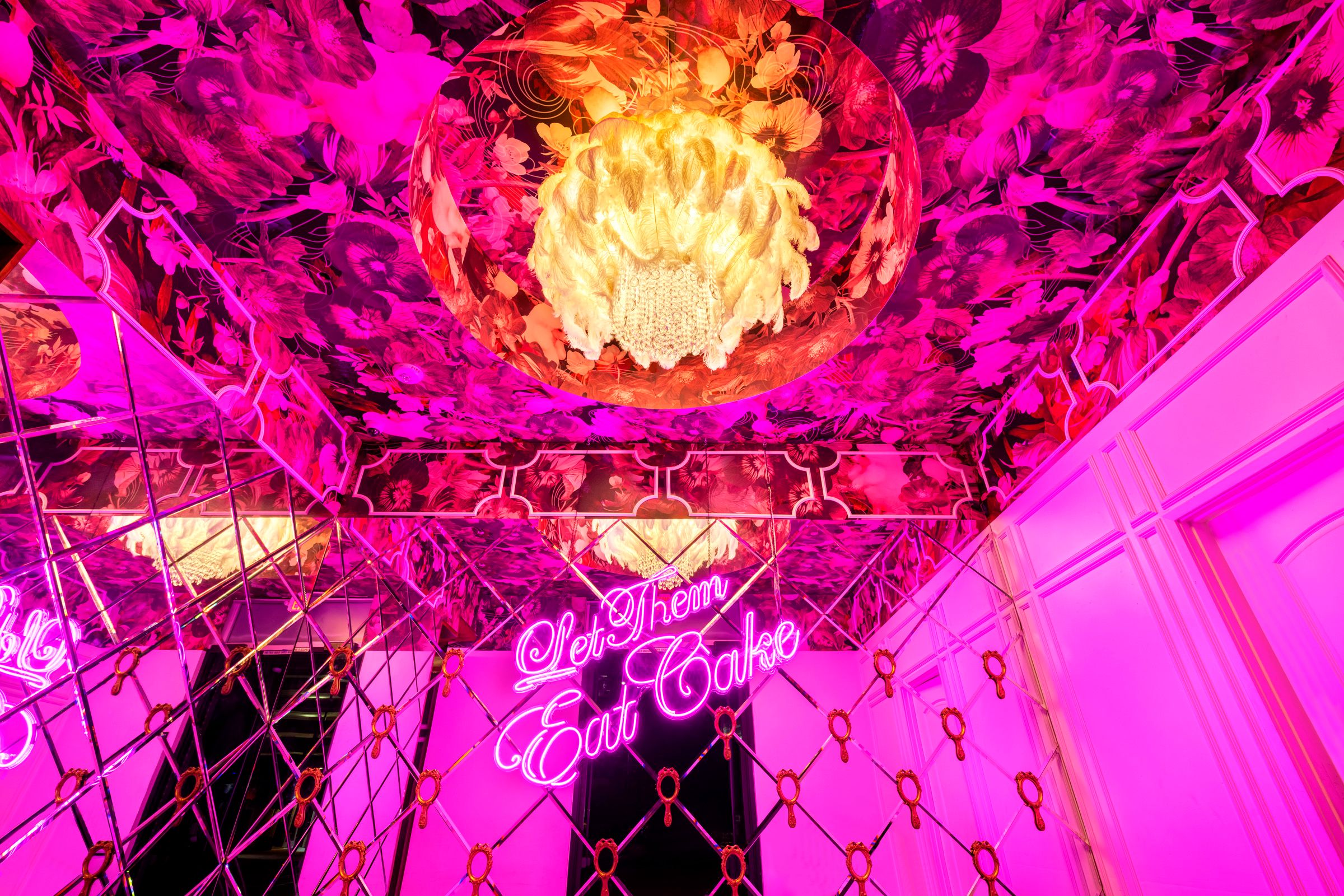 Floral ceiling and chandelier in the pink room at CAKE Nightclub