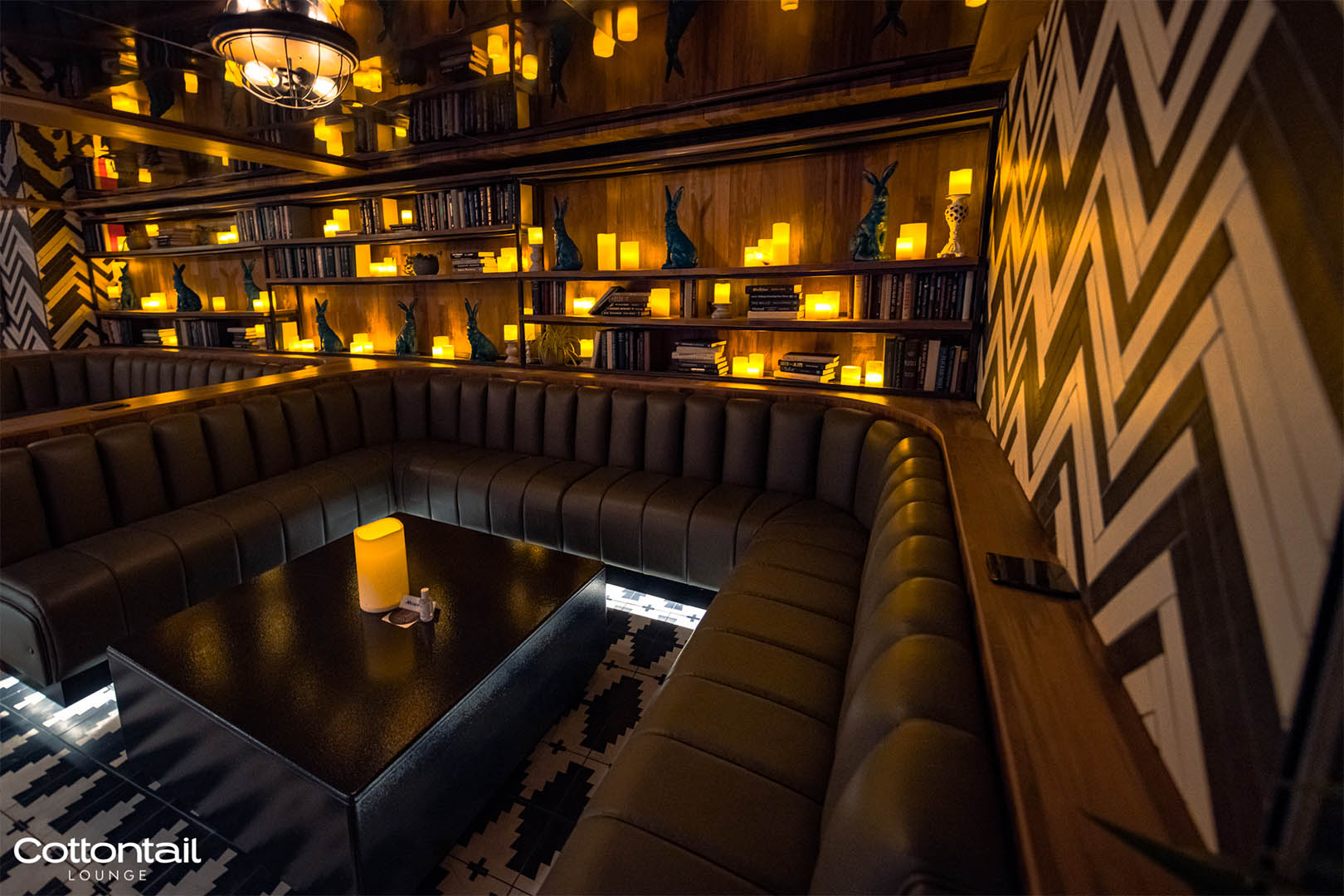 Candlelit booth seating at Cottontail Lounge