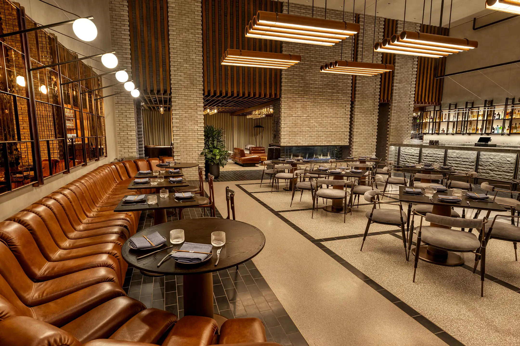 KAUBOI dining room with leather banquettes and the bar in Scottsdale