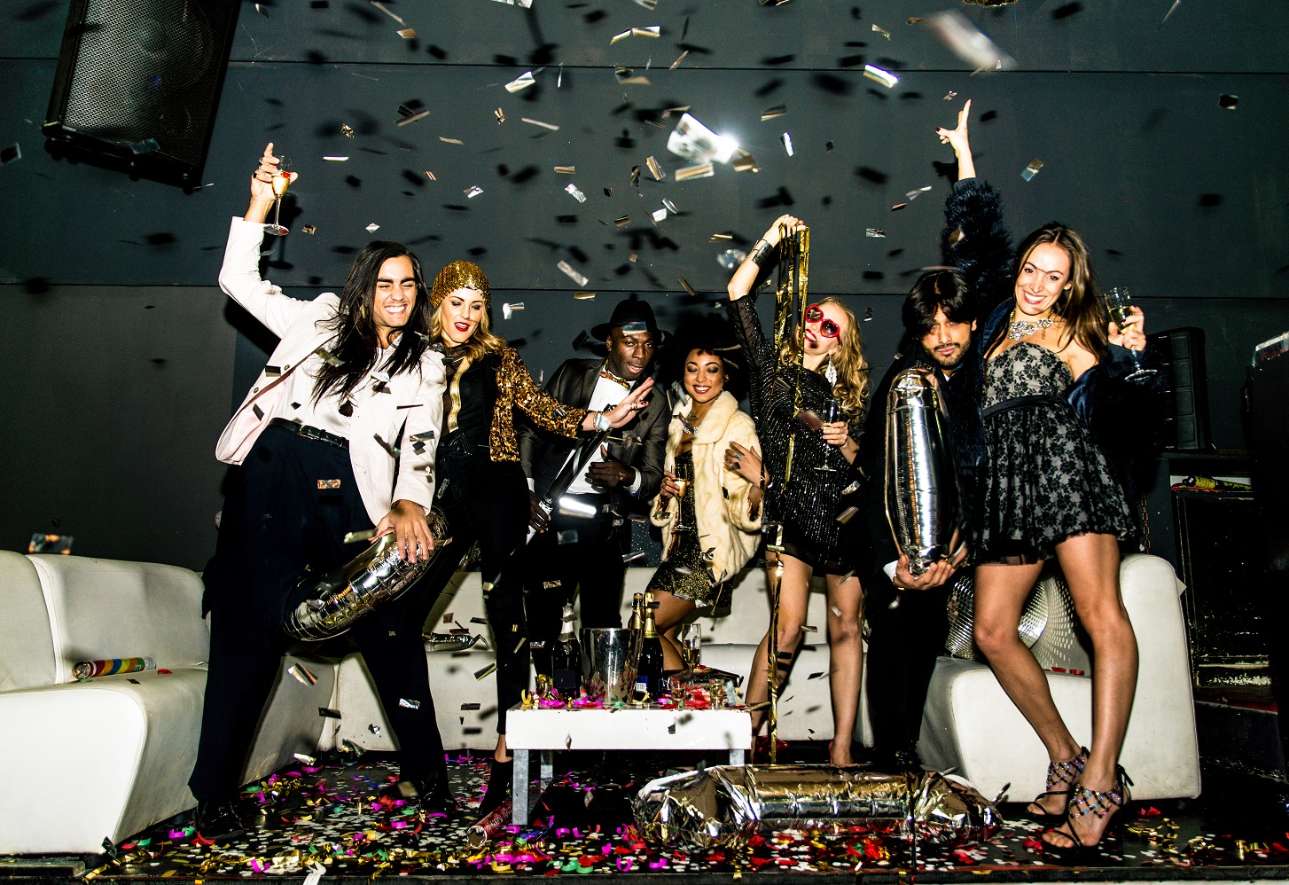 Party guests in confetti at a VIP table at El Hefe Scottsdale